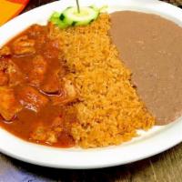 Pollo A La Diabla · Tender pieces of chicken in a spicy red sauce. Served with rice, beans and choice of tortill...