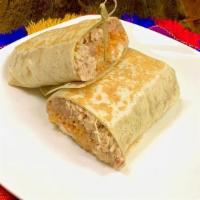 Shredded Chicken Burrito · Shredded chicken with rice, beans, sour cream and cheese inside lunch style burrito.