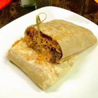 Shredded Beef Burrito · Shredded beef burrito with rice, beans, sour cream and cheese inside lunch style burrito.