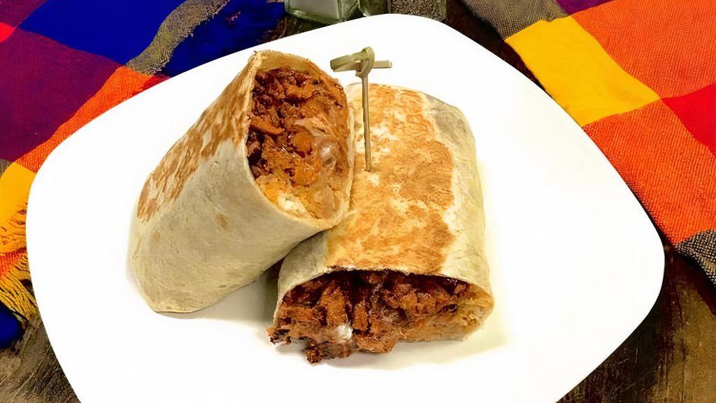 Al Pastor Burrito · Al pastor meat with rice, beans, sour cream and cheese inside lunch style burrito.