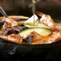 Mixto Molcajete · Combination of Grilled chicken, asada steak and shrimp pieces in a mild spicy housemade toma...