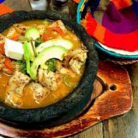 Grilled Chicken Molcajete · Grilled chicken pieces in a mild spicy housemade tomatillo sauce. Rice, whole beans, bell pe...