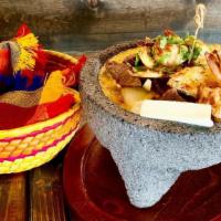 Shrimp Molcajete · Grilled shrimp in a mild spicy housemade tomatillo sauce. Rice, whole beans, bell peppers an...