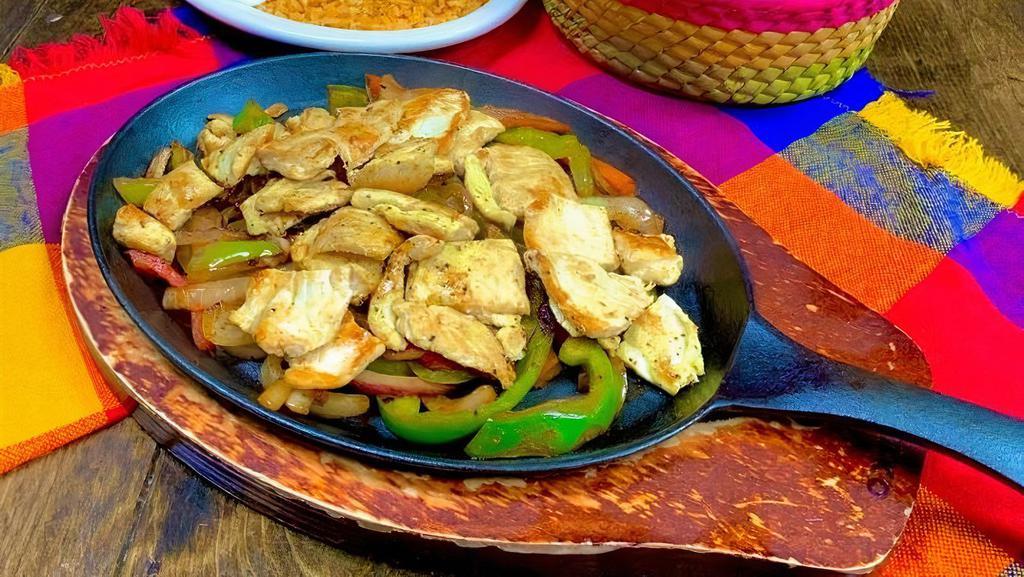 Grilled Chicken Fajitas · Grilled chicken pieces in a mix of grilled onions, bell peppers and shredded cheese. Served with rice, beans, guacamole and sour cream on the side. Choice of tortillas.