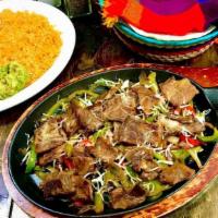 Steak Fajitas · Asada steak in a mix of grilled onions, bell peppers and shredded cheese. Served with rice, ...
