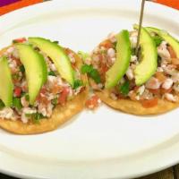 2 Ceviche Tostadas · Lime marinated shrimp in a mix with pico de gallo and fresh avocado slices on top.
