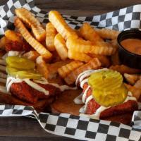 Combo #5 · Two fish strips served with pickles, tartar sauce, and a side of fries.