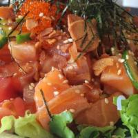 Poke Plate · A plate of large portion poke on a bed of lettuce. Served with your choice of base with your...