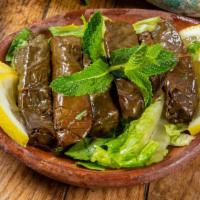 Grape Leaves (6 Pcs) · Rice, tomato, parsley, onion, olive & lemon sauce rolled in grape leaves.