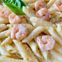 Shrimp Alfredo Pasta · Sate shrimps on  Alfredo sauce over penne pasta.