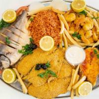 Assorted Fried Fish Tray · All fried sea products  Whole Pompano fish, Shrimp,Filet fish, Fresh sliced fish, all on Ric...