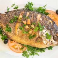 Tilapia Fish ($6/Lb) · (Min order 3.00 Lb and up )per fish
Cooked slowly in clay oven (Tandoori) with wood fire 
Co...