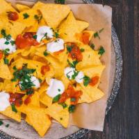 Nachos · Corn Tortilla Chips with Cheese and Jalepeños