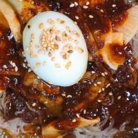 Bibim-Naengmyeon · Spicy. Cold buckwheat noodles with red pepper paste. Comes with sauces and kimchi.