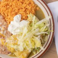 Enchiladas Suizas · Two chicken enchiladas with green sauce, sour cream & lettuce.