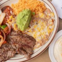 Carne Asada · Cooked Mexican style with a cheese enchilada, bell pepper, onion & tomato.