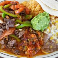 Steak Picado · Chopped asada cooked in our house salsa with bell pepper, onion & tomato carne asada.