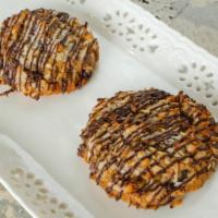 Almond Joyous · Dough : Almond Joy Mix-ins : Toasted Coconut, Dark Chocolate, & Toasted Almonds CONTAINS NUTS