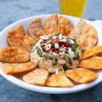 Mediterranean Hummus  · Vegan chickpea sun-dried tomato hummus, roasted red peppers, toasted almonds, pita chips.