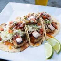 Blackened Mahi Tacos · With Guajillo salsa, shredded cabbage, cheddar, cotija, chipotle sour cream, pico de gallo, ...