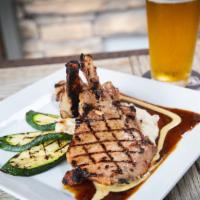 Beer-Brined Pork Chops · Two 8oz center cut loin chops with Firecracker and spicy mustard sauce. Comes with two sides...