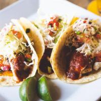 Mahi Mahi Tacos · Guajillo salsa, shredded cabbage, cheddar, cotija, chipotle sour cream, pico de gallo, flour...