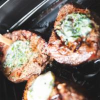 Ribeye Steaks · 12oz. portions, topped with herb butter– # of steaks