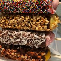 Esquimales · Popsicles covered in chocolate and sprinkled with nuts