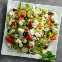 Greek Salad · Romaine lettuce, tomatoes, cucumbers, bell peppers, red onions, black olives, feta cheese, a...