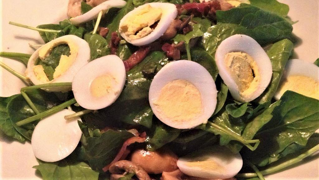 Spinach Salad · Baby spinach, mushrooms, red onion, bacon, hard
boiled egg with warm bacon vinaigrette dressing.