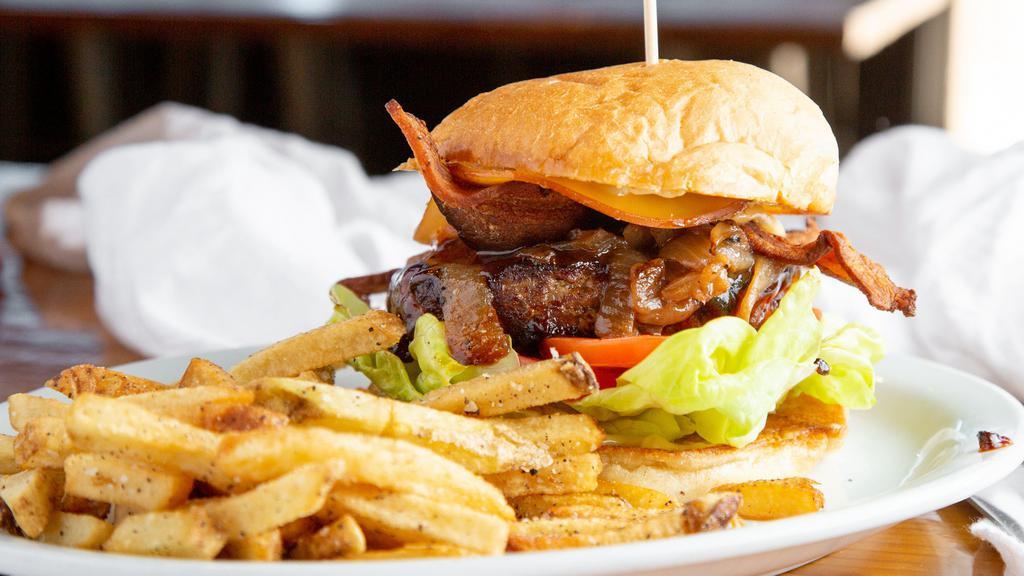 Whiskey Burger · Ground chuck, BBQ sauce, provolone cheese , bacon,
caramelized onions, roasted garlic aioli, bibb lettuce
and tomatoes (garlic aioli contains raw egg).