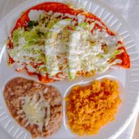 Enchilada Combo · Three enchilada plate topped with lettuce, tomato, avocado, sour cream, and cheese. Served w...