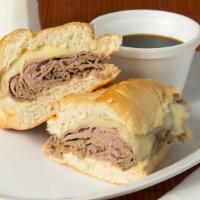French Dip · Roast beef with melted swiss cheese served with Au Jus on a french roll.