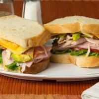 Club Sandwich · Turkey, ham, bacon, lettuce, tomato, mayo, cheddar cheese on Sourdough.