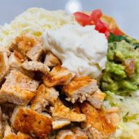 Tostada Salad · Beans, rice, lettuce, avocado, cheese, grilled chicken, tomato, and sour cream.