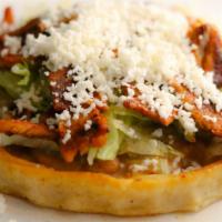 Sope · Handmade corn tortilla pinched on the sides, topped with beans, onion, lettuce, choice of me...