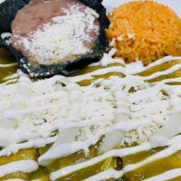 Enchiladas Verdes · Three enchiladas stuffed with chicken and cheese, topped with our green sauce, onion, sour c...