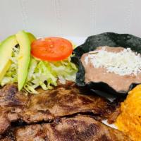 Carne Asada Combo · Grill sliced thin steak served with rice, beans, small side salad (lettuce, tomato, and avoc...