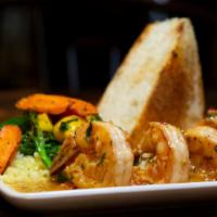 Camarones Al Ajillo · Mexican sweet shrimp,
chile de árbol garlic butter, cilantro lime rice, ciabatta.