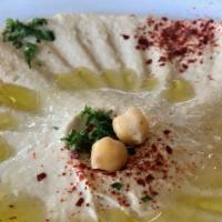 Hummus · Vegan. Garbanzo beans blended with sesame tahini paste, fresh lemon juice, and extra virgin ...