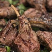 Grilled Lamb Chops · Australian lamb chops, roasted garlic mash, lamb jus sauce, sauteed onions and portobello mu...