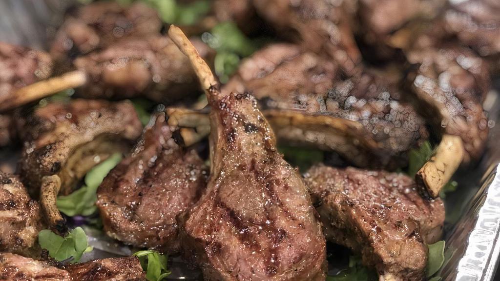 Grilled Lamb Chops · Australian lamb chops, roasted garlic mash, lamb jus sauce, sauteed onions and portobello mushrooms