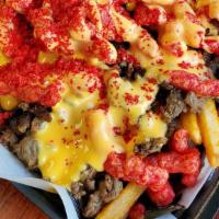 Hot Cheetos Fries · Carne asada, cheedar cheese ,sourcream,  hot cheetos on top, with nacho cheese on top