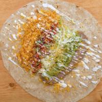 Veggie Burrito · Refried beans, rice, lettuce, cheese, pico, sour cream, and guacamole on a flour tortilla.