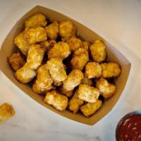 Tater Tots · Perfectly golden tater tots. Includes a side of ketchup.