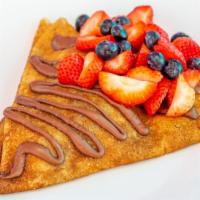 Signature Crepe 1 · Stuffed with Nutella and diced bananas. Topped with Nutella, strawberries and blueberries.