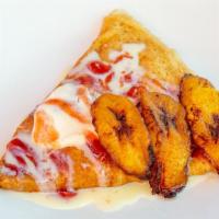 Fried Plantain Crepe · Stuffed with fried plantain and sweetened cream cheese. Topped with fried plantain, strawber...