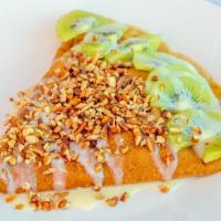 Signature Crepe 2 · Stuffed with lechera (condensed milk) and strawberries. Topped with lechera (condensed milk)...