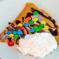 Signature Crepe 3 · Stuffed with a fruit. Topped with chocolate syrup lechera whipped cream M&M's.