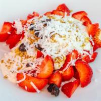 Fresas Con Crema · Strawberries carried with sweetened cream. Topped with granola, coconut, and raisins.